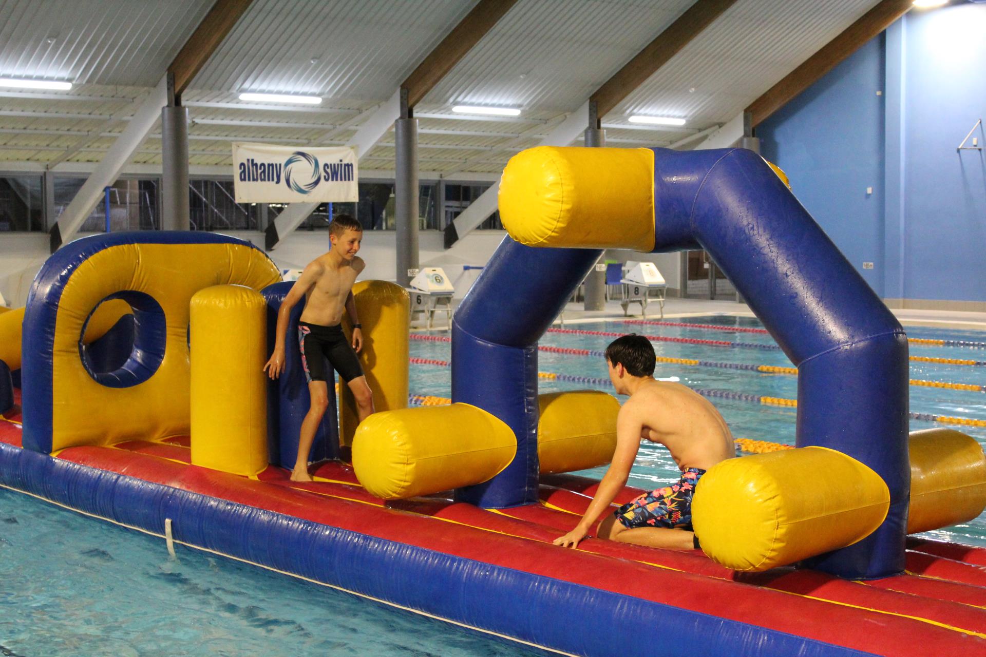 Two Children using Pool Inflatables